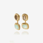 Boucle d'oreilles clips dorée avec ses pierres fines. Bijoux fantaisie pour femme et bijou tendance et créateur.